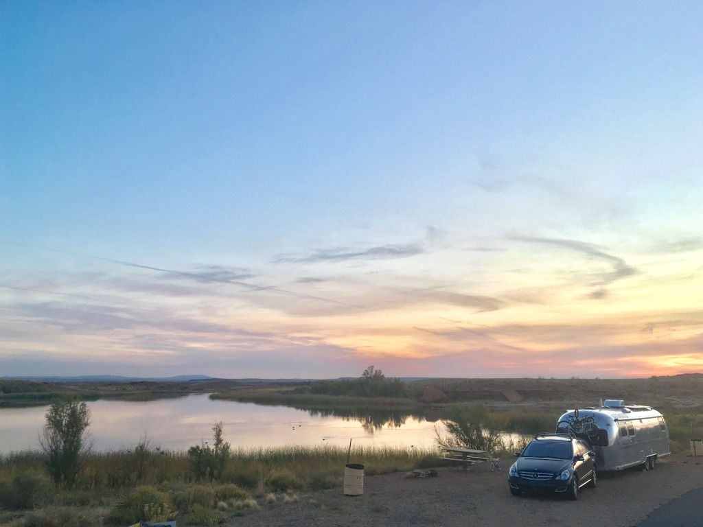 Off-grid Airstream boondocking in remote desert landscape