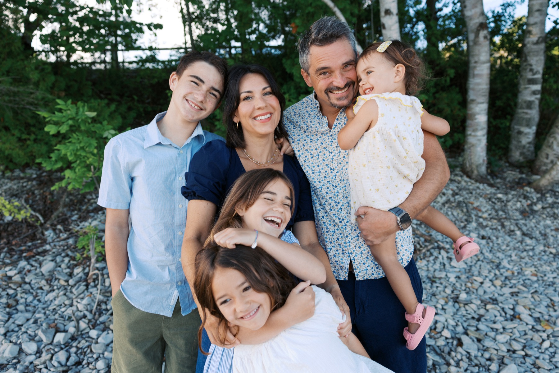 The Stewart family smiling together outdoors